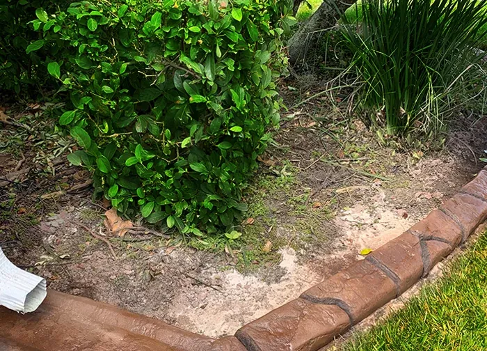Built-in rain drain in a curb